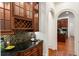 Butlers pantry with wine rack and granite countertops at 6206 Zell Miller Nw Path, Acworth, GA 30101