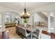 Elegant dining room with chandelier and access to the living room at 6206 Zell Miller Nw Path, Acworth, GA 30101