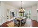 Formal dining room with chandelier and view into the living room at 6206 Zell Miller Nw Path, Acworth, GA 30101