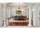 Bright dining room with hardwood floors, chandelier, and large windows at 6206 Zell Miller Nw Path, Acworth, GA 30101