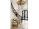 Grand entry with curved staircase, chandelier, and ornate double doors at 6206 Zell Miller Nw Path, Acworth, GA 30101