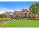 Stunning brick home with beautiful landscaping and a large lawn at 6206 Zell Miller Nw Path, Acworth, GA 30101