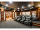 Basement home theater with seating for eight and kitchen views at 6206 Zell Miller Nw Path, Acworth, GA 30101