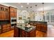 Open kitchen with large island, breakfast bar, and hardwood floors at 6206 Zell Miller Nw Path, Acworth, GA 30101