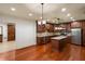 Island kitchen with stainless steel appliances and hardwood floors at 6206 Zell Miller Nw Path, Acworth, GA 30101