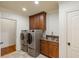 Convenient laundry room with washer, dryer, and utility sink at 6206 Zell Miller Nw Path, Acworth, GA 30101
