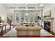Bright living room with hardwood floors, fireplace, and large windows at 6206 Zell Miller Nw Path, Acworth, GA 30101
