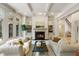 Spacious living room with a fireplace, built-in shelving, and hardwood floors at 6206 Zell Miller Nw Path, Acworth, GA 30101