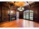 Spacious office with wood paneled walls, fireplace, and hardwood floors at 6206 Zell Miller Nw Path, Acworth, GA 30101