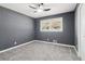 Spacious bedroom with gray walls, gray carpet, and ceiling fan at 2916 Handy Nw Dr, Atlanta, GA 30318