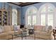 Living room with vaulted ceilings, arched windows, and a comfy sofa at 439 Blackland Nw Rd, Atlanta, GA 30342