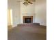 Spacious living room with a brick fireplace and neutral carpeting at 2818 Mill Lake Walk, Morrow, GA 30260