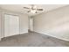 Bright bedroom featuring double door closet and ceiling fan at 647 Bralorne Dr, Stone Mountain, GA 30087