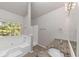 Bathroom with granite countertop and bathtub at 116 Rolling Meadows Ct, Hampton, GA 30228