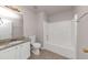 Bathroom with granite countertop and bathtub at 116 Rolling Meadows Ct, Hampton, GA 30228