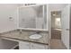 Bathroom features granite vanity, updated fixtures, and access to bedroom at 116 Rolling Meadows Ct, Hampton, GA 30228