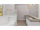 Bathroom with granite countertop, white cabinets, and a large mirror at 116 Rolling Meadows Ct, Hampton, GA 30228