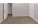 Simple bedroom with neutral walls and carpet at 116 Rolling Meadows Ct, Hampton, GA 30228