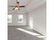 Bright bedroom with ceiling fan and carpet at 116 Rolling Meadows Ct, Hampton, GA 30228