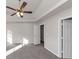 Primary bedroom with ceiling fan and carpet at 116 Rolling Meadows Ct, Hampton, GA 30228