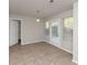 Bright dining area with tile floors and access to a patio at 116 Rolling Meadows Ct, Hampton, GA 30228
