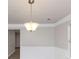 Dining room with crown molding and a light fixture at 116 Rolling Meadows Ct, Hampton, GA 30228