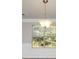 Bright dining room with crown molding and pendant lighting at 116 Rolling Meadows Ct, Hampton, GA 30228