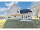 Two-story house features a backyard and patio at 116 Rolling Meadows Ct, Hampton, GA 30228