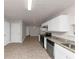 Open kitchen with stainless steel appliances and granite countertops at 116 Rolling Meadows Ct, Hampton, GA 30228