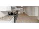 Bright kitchen featuring granite countertops and white cabinets at 116 Rolling Meadows Ct, Hampton, GA 30228