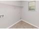 Laundry room with tile floor and overhead shelving at 116 Rolling Meadows Ct, Hampton, GA 30228