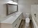 Updated bathroom with white vanity, quartz countertop, and a large mirror at 2683 Meadowlawn Se Dr, Marietta, GA 30067
