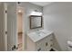 Updated bathroom with white vanity, quartz countertop, and a large mirror at 2683 Meadowlawn Se Dr, Marietta, GA 30067