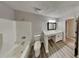 Updated bathroom with white vanity, quartz countertop, and a large mirror at 2683 Meadowlawn Se Dr, Marietta, GA 30067