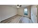Bright bedroom with wood-look flooring and double doors at 2683 Meadowlawn Se Dr, Marietta, GA 30067