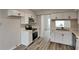Modern kitchen with white shaker cabinets, stainless steel appliances, and a quartz countertop at 2683 Meadowlawn Se Dr, Marietta, GA 30067