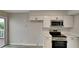 Modern kitchen with white shaker cabinets, stainless steel appliances, and a quartz countertop at 2683 Meadowlawn Se Dr, Marietta, GA 30067