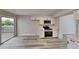 Modern kitchen with white shaker cabinets, stainless steel appliances, and a quartz countertop at 2683 Meadowlawn Se Dr, Marietta, GA 30067