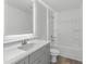 Bathroom with grey vanity, quartz countertop, and a bathtub at 3328 Pepperpike Ct, Loganville, GA 30052