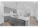 Modern kitchen with gray cabinets, white countertops, and an island at 3328 Pepperpike Ct, Loganville, GA 30052