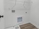 Laundry room with built-in shelving and space for a washer and dryer at 3328 Pepperpike Ct, Loganville, GA 30052