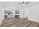 Open living room with wood-look floors and a fireplace at 3328 Pepperpike Ct, Loganville, GA 30052