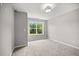 Spacious bedroom with large window and neutral decor at 1101 Cooks Farm Way, Woodstock, GA 30189