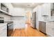 Modern kitchen featuring white cabinets and stainless steel appliances at 328 Waters Edge Pkwy, Temple, GA 30179