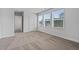 Spacious bedroom with neutral colored carpet and large windows at 819 Major Oak Ct, Villa Rica, GA 30180