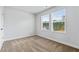 Simple bedroom with carpet and two large windows at 819 Major Oak Ct, Villa Rica, GA 30180