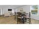 Bright dining area with table and chairs, hardwood floor at 819 Major Oak Ct, Villa Rica, GA 30180