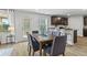 Modern dining room with a long wooden table and chairs at 819 Major Oak Ct, Villa Rica, GA 30180
