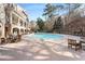 Community pool with plenty of lounge chairs at 200 River Vista Dr # 412, Atlanta, GA 30339