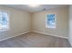 Well-lit bedroom featuring neutral walls and carpet at 329 Mount Zion Sw Rd, Atlanta, GA 30354